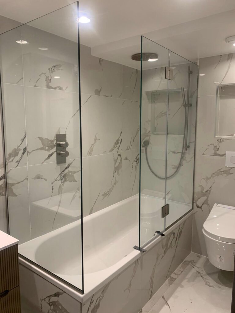 Frameless glass shower screen fitted in West London by Zeenee Aluminium